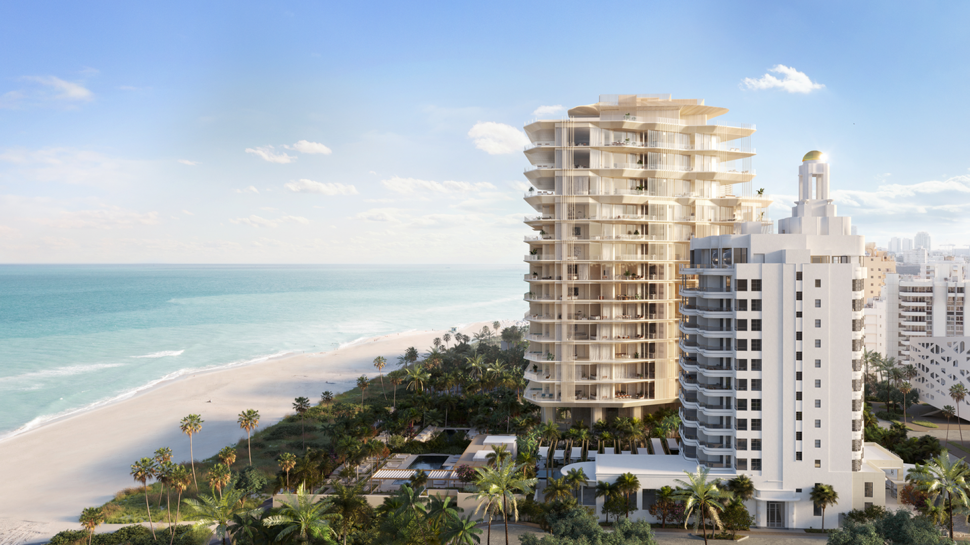  Beachfront view of a luxurious, modern high-rise, next to a historic white building.