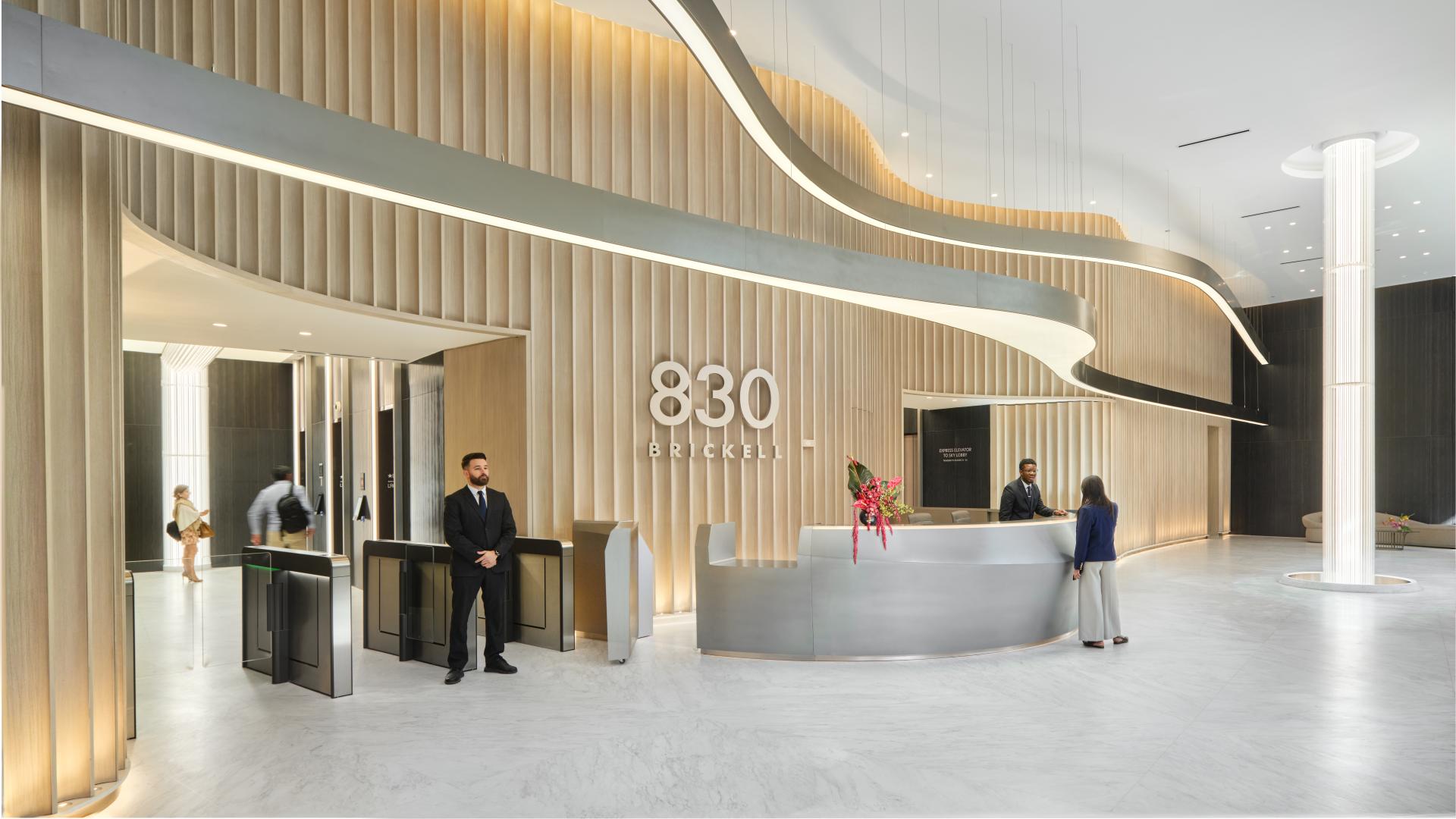 A modern, luxurious lobby interior with sleek, minimalist design elements.