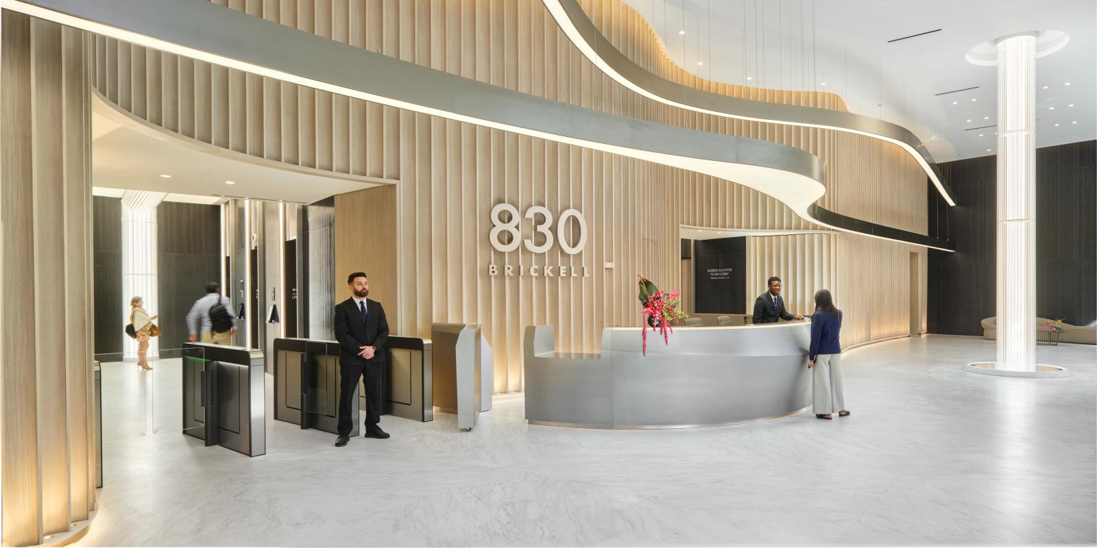 A modern, luxurious lobby interior with sleek, minimalist design elements.